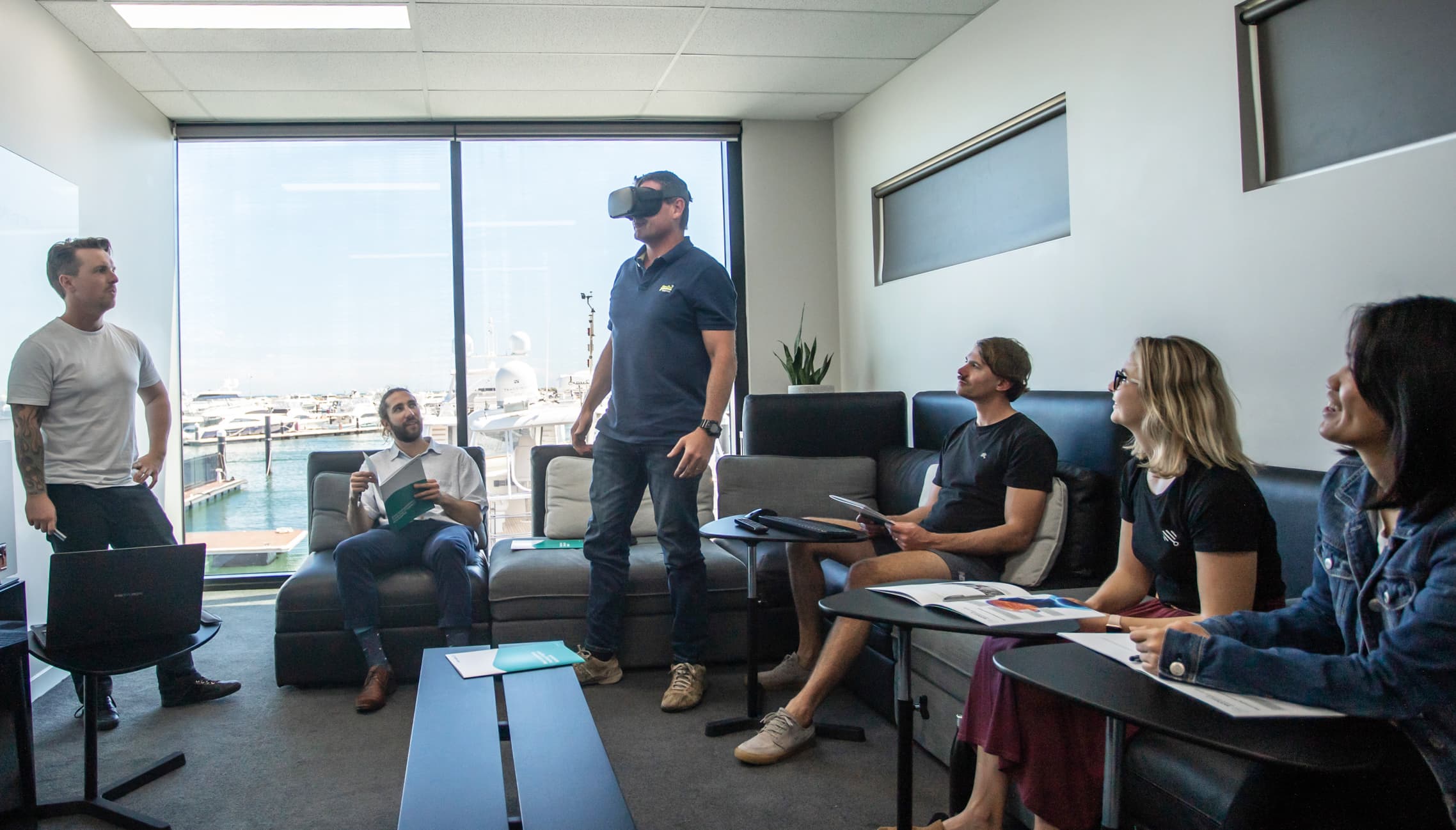 vr training pros and cons group of people in a VR company learning the pros and cons of vr training
